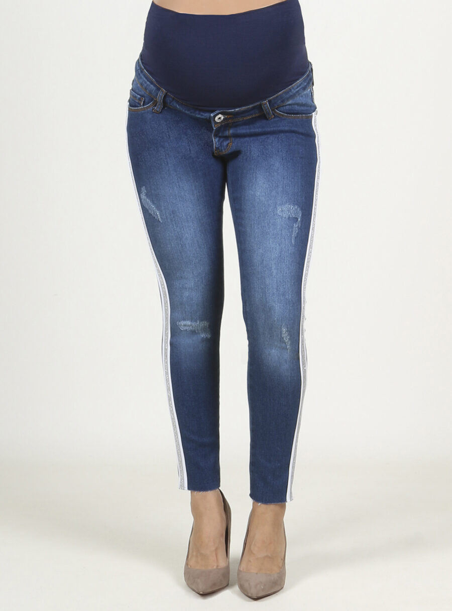 Jeans slim tobillero con tiras fantasía en los laterales